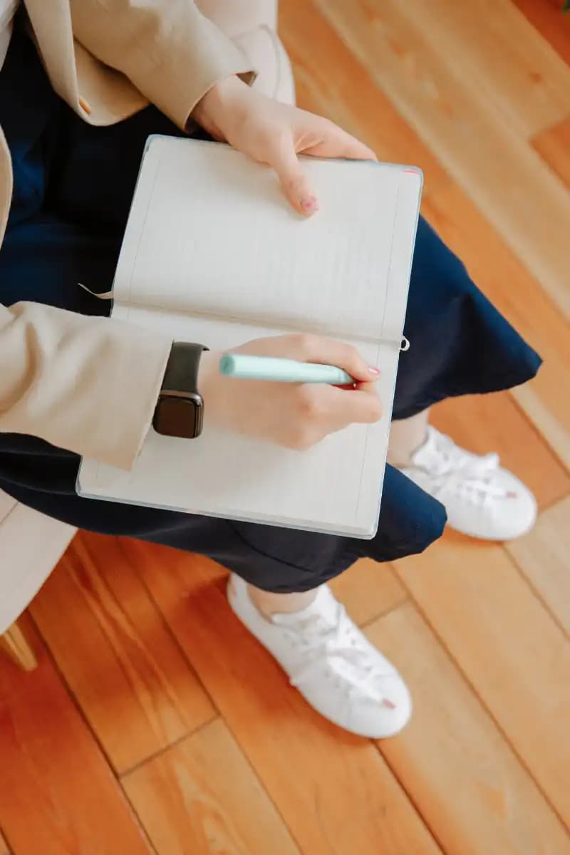 Therapist taking notes during a counseling session