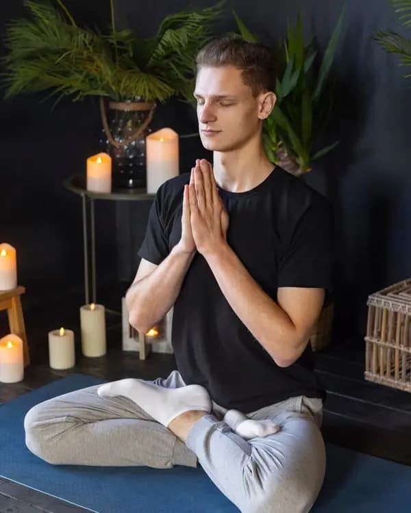 Reiki practitioner with singing bowl during a session