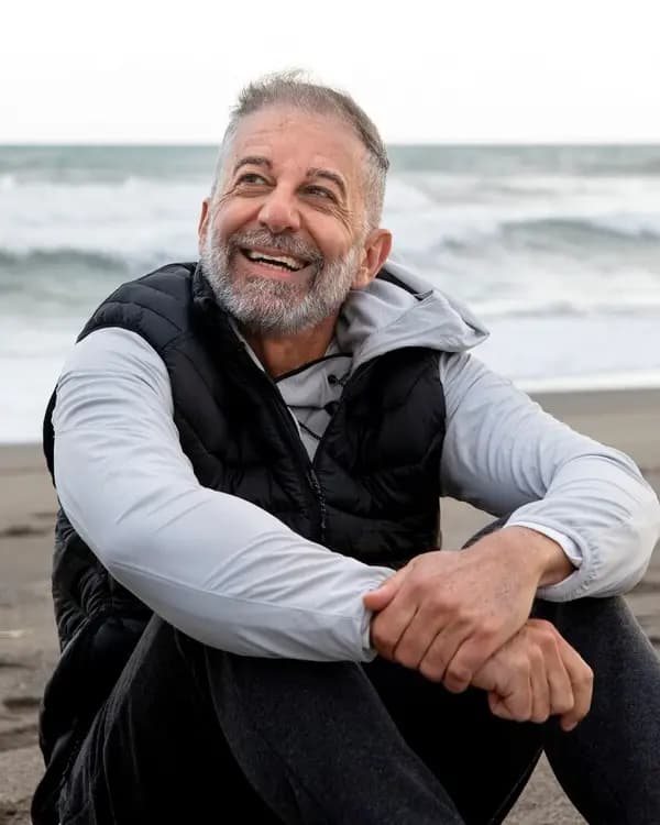 Elderly man at the beach, peaceful expression